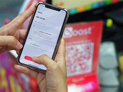 axiata digital rebrands  fintech services  boost
