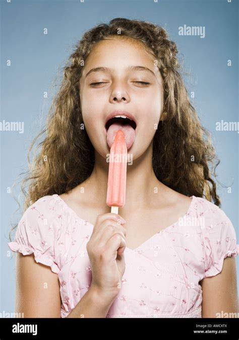 Girl eating Popsicle Stock Photo - Alamy