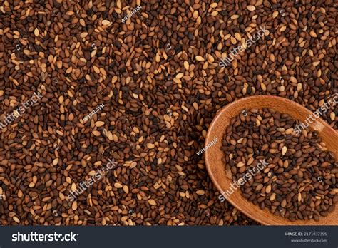 red sesame seeds wooden spoon  stock photo  shutterstock