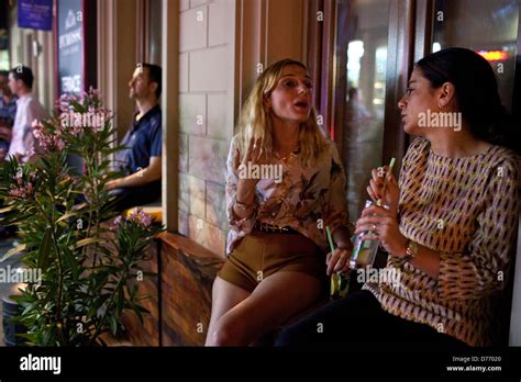 Women talking, Nightlife in Beyoglu, Istanbul, Turkey Stock Photo: 56087416 - Alamy