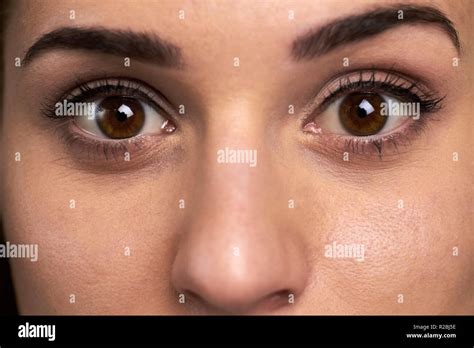 Widely open eyes of young woman. Close up face of pretty girl with open ...