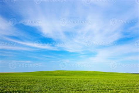 Green field landscape, sunny blue sky 7825236 Stock Photo at Vecteezy
