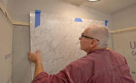 how to install shower wall panels with adhesive