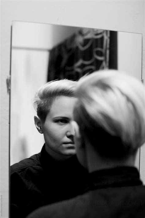 "Lesbian Woman With Mirror" by Stocksy Contributor "Alexey Kuzma" - Stocksy