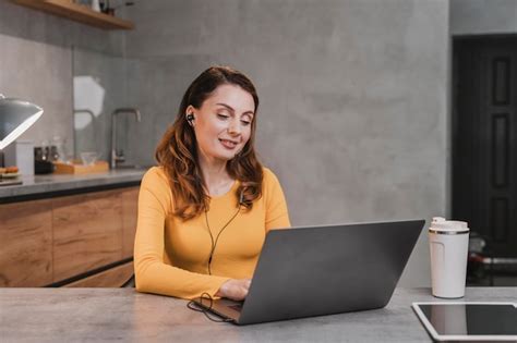 Free Photo | Medium shot woman streaming in kitchen