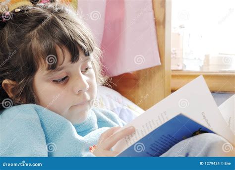 small girl reading stock photo image  room safety