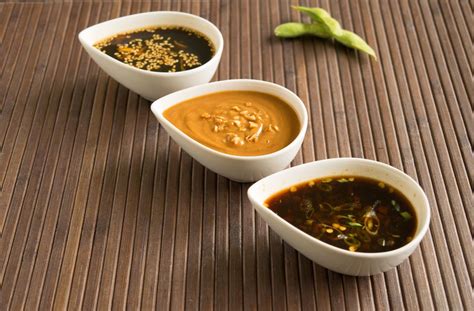 Trio of Asian inspired dipping sauces: Honey Sesame Sauce, Spicy Soy Sauce, and Savory Peanut ...