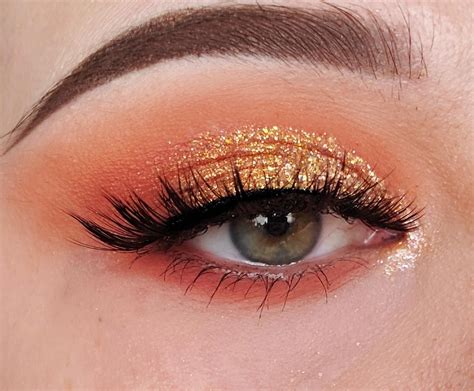 Gold glitter and coral eyeshadow look | Coral eye makeup, Colorful eye ...