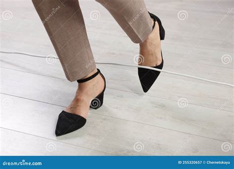 Woman Tripping Over Cord Indoors, Closeup View Stock Image - Image of ...