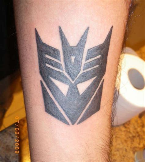 Decepticon logo | Transformer tattoo, Arm tattoos for guys, Decepticons ...