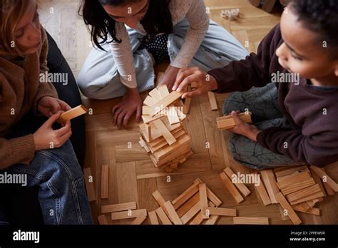 Children playing jenga at home Stock Photo - Alamy