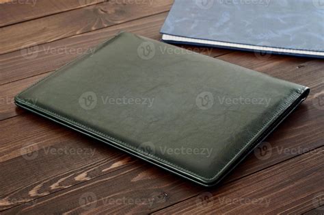 Green business leather folder closeup 1061738 Stock Photo at Vecteezy