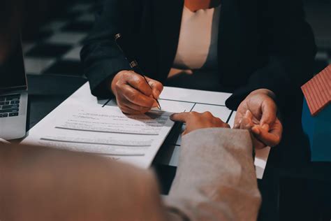 Close up Business people or Real Estate agent explain signing agreement