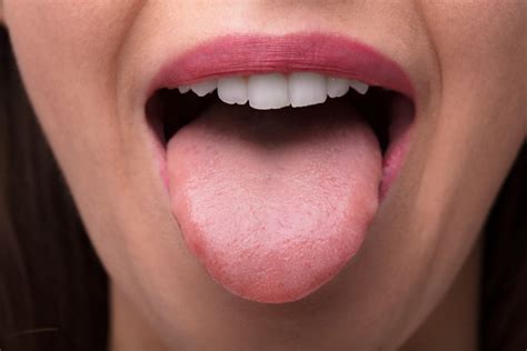 Why does my dentist make me stick out my tongue?
