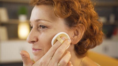 Close-up female face applying make-up. 43824169 Stock Video at Vecteezy