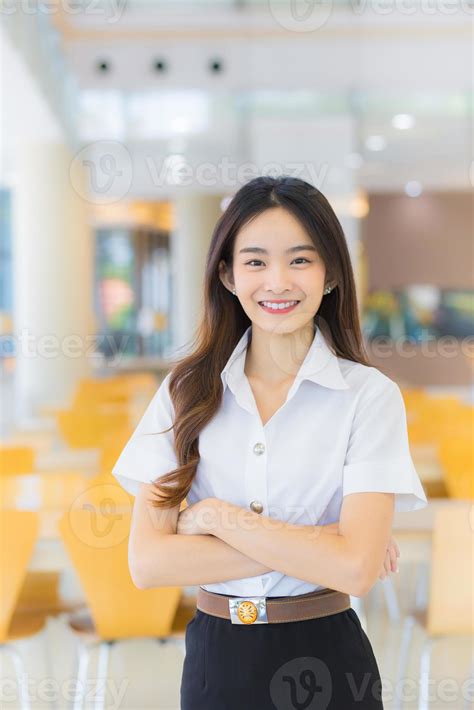 Portrait of an adult Thai student in university student uniform. Asian