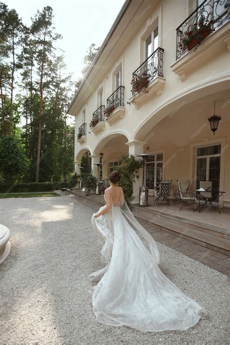 Premium Photo | Young model woman in lace wedding dress escape from the