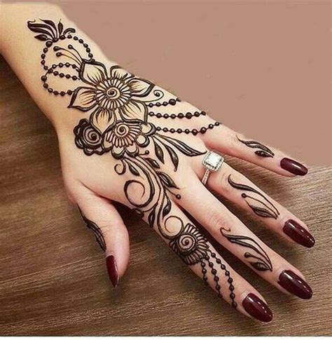 22.Trendy flower and dots back henna design - Wedandbeyond