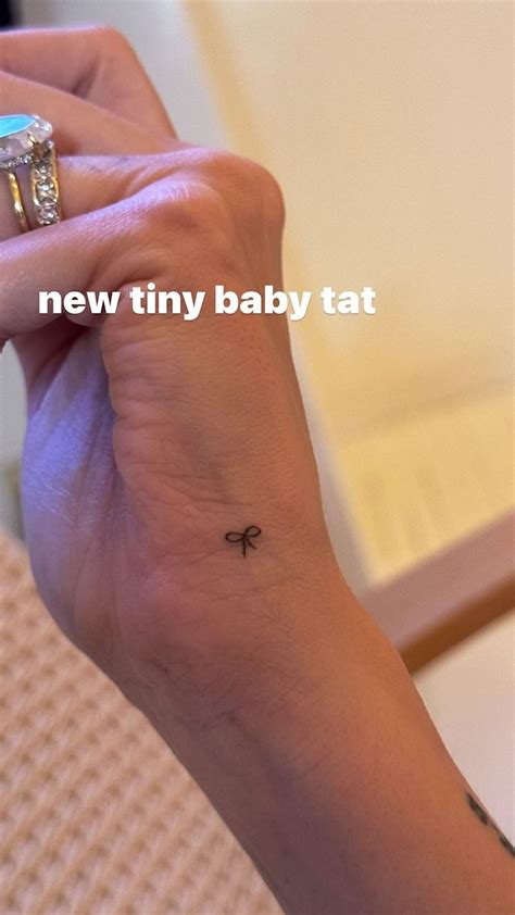 Hailey Bieber Debuted A Tiny Bow Tattoo & It's *Peak* Coquette