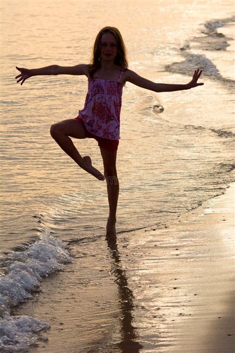 Happy Girl Dancing On The Beach At The Sunset Time Stock Image - Image of laughing, active: 75551851