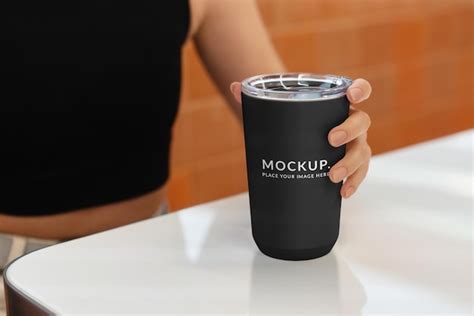 tumbler mock  coffee    hand plastic cup premium psd