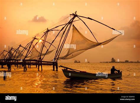 Sunset over Chinese Fishing nets in Cochin Stock Photo - Alamy