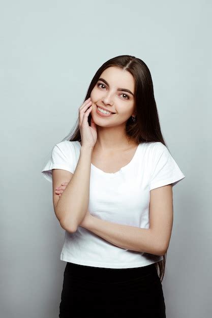 Premium Photo | Portrait of a girl smiling on a white background