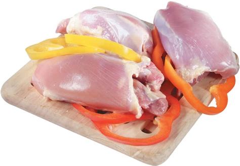 Raw Chicken Thighs - Prepared Food Photos, Inc.