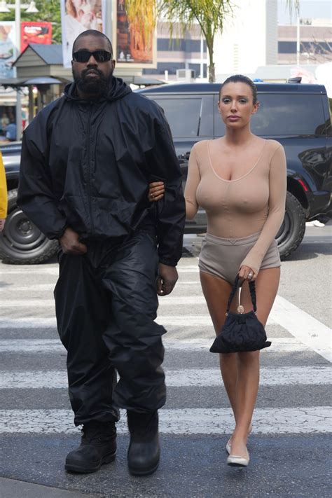 Bianca Censori looks somber as she goes braless during second trip to