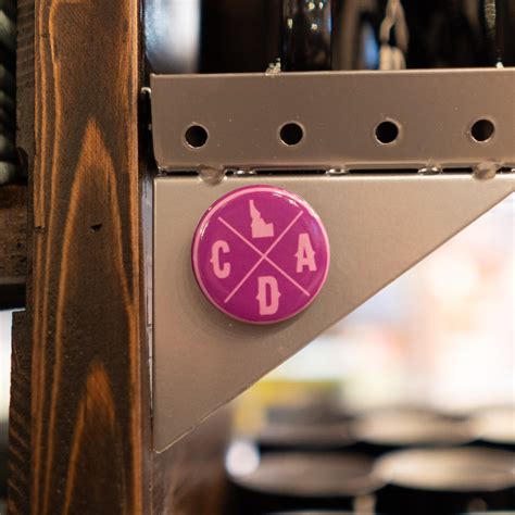 bold purple cda idaho logo magnet cda idaho clothing company