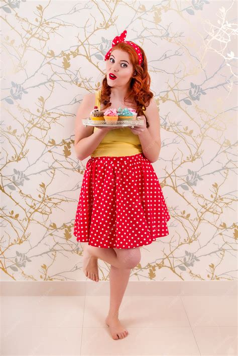 Premium Photo | View of a beautiful pinup redhead girl holding a tray