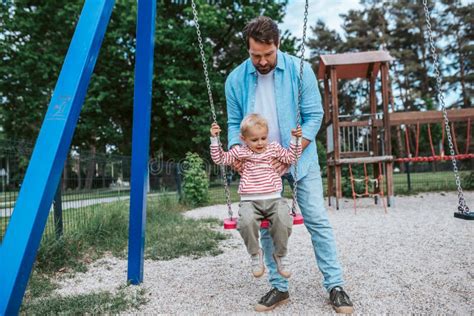 father swinging   baby boy stock image image  gentleness