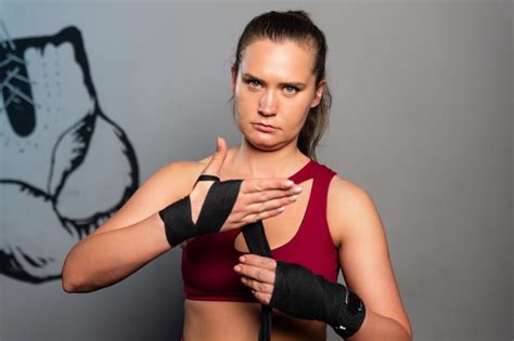 Premium Photo | Portrait of a sporty woman who is preparing for boxing ...