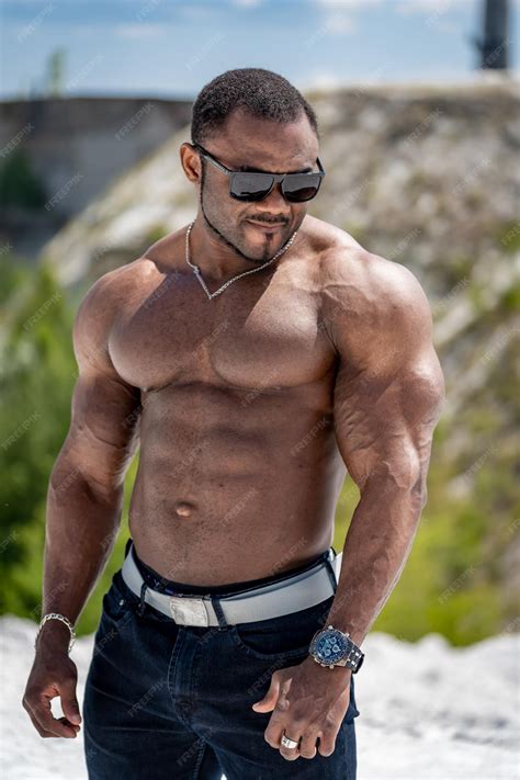 Premium Photo | Young athletic muscular guy with naked torso