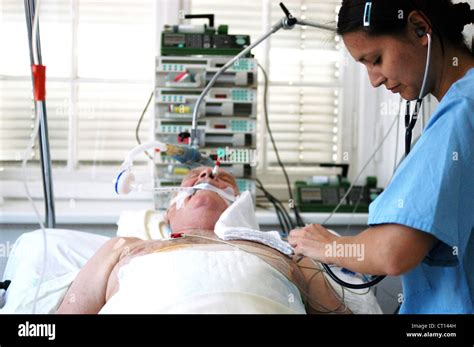 Physican when examining a comatose patient Stock Photo, Royalty Free ...