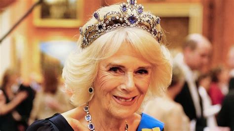 Queen Camilla wearing King Charles' coat and stunning tiara | Woman & Home