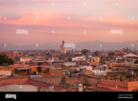 Marrakech city skyline in Medina area, with Atlas mountains behind ...