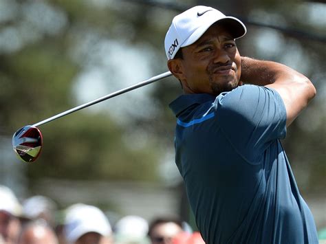 The Tiger's not for turning: Woods defies calls to quit after
