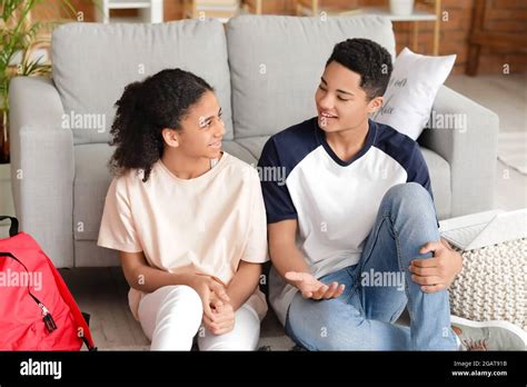 African-American brother and sister studying at home Stock Photo - Alamy