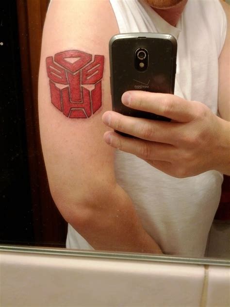 autobot logo tattoo | Body art tattoos, Tattoos, Triangle tattoo