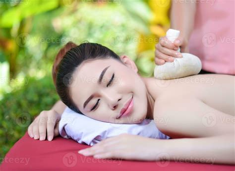 Beautiful Asian girl doing spa massage 23371339 Stock Photo at Vecteezy