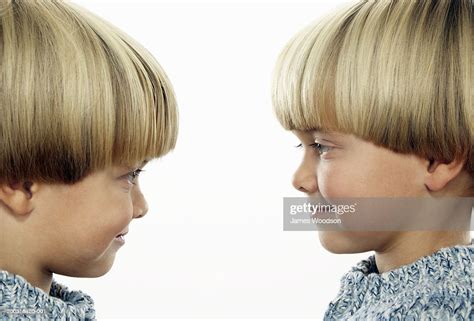 twin boys face  face smiling side view closeup photo getty images