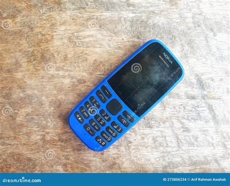 Indonesia March 29, 2023 - Old Nokia Phone on Wooden Surface Editorial