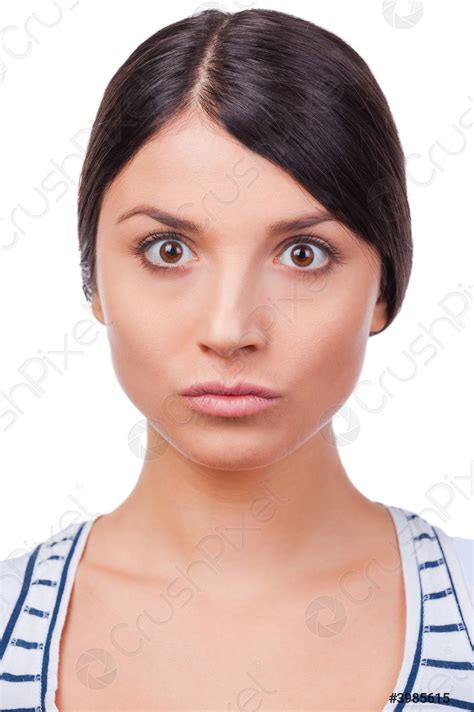 Outraged and evil Angry young women staring at camera while - stock