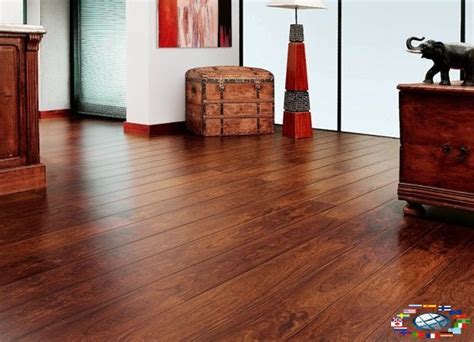 a living room with wooden floors and an elephant figurine on the end table