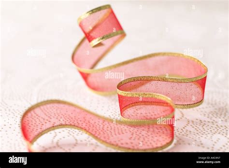 Sheer Red & Gold Ribbon Curl Stock Photo - Alamy