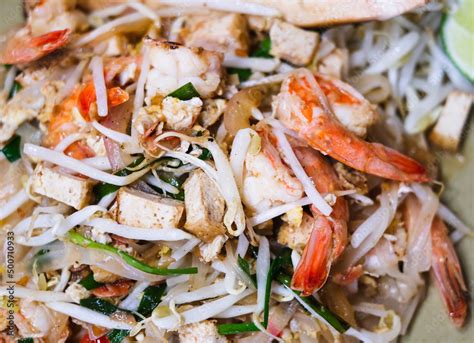 Pad thai, phat thai, or phad thai, is a stir-fried rice noodle dish ...