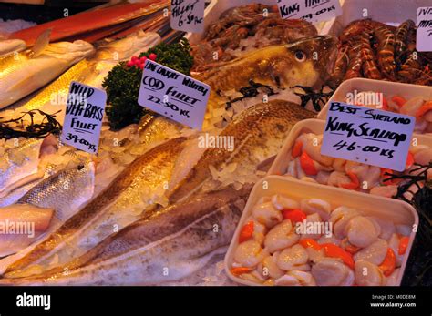 fresh fish at a fishmongers stall on borough market in central London ...