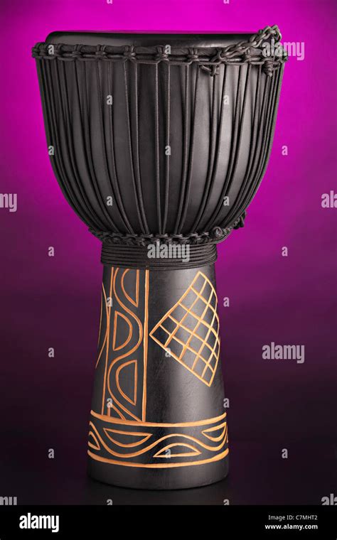 black african djembe drum isolated   purple spotlight