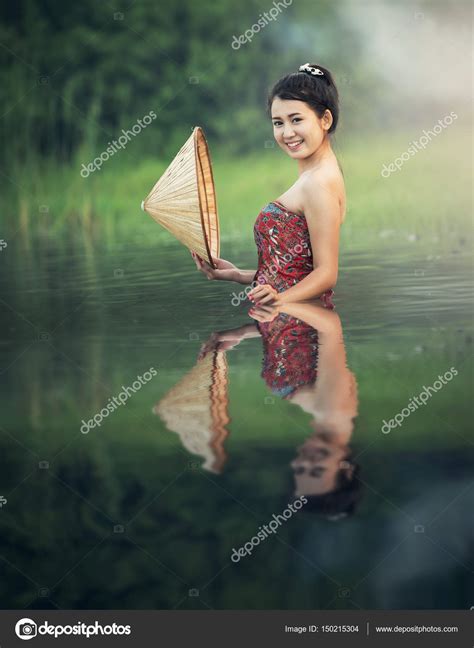 Asian sexy women bathing at river — Stock Photo © tipchai #150215304